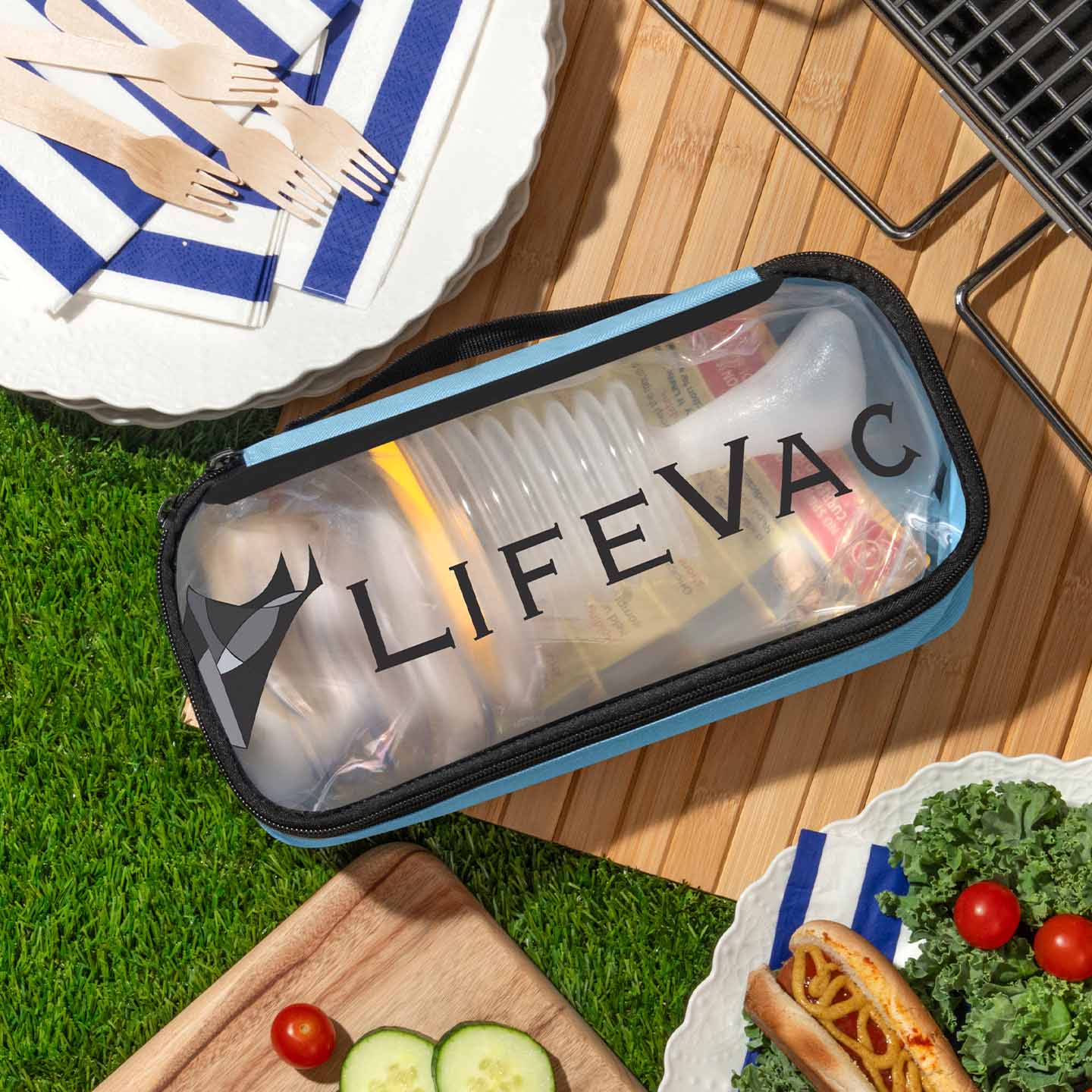 LifeVac Blue Travel Kit in a picnic setting